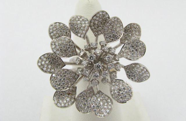 Appraisal: K White gold flower motif diamond ring with approximately ct