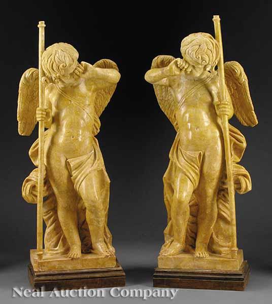 Appraisal: A Monumental Pair of Carved Sienna Marble Cherubs height in