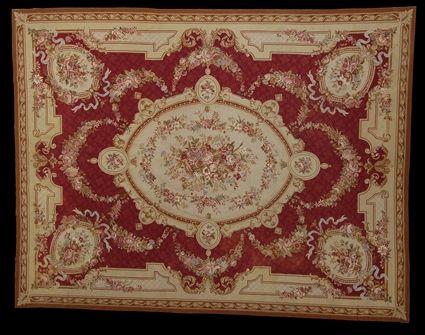 Appraisal: AUBUSSON DESIGN NEEDLEWORK CARPET The central oval floral medallion supporting