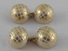 Appraisal: A pair of French hallmarked carat gold and white enamel