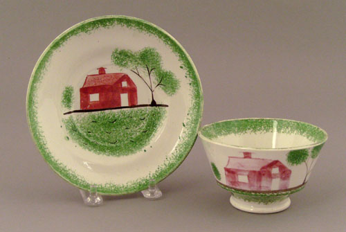 Appraisal: Green spatter cup and saucer th c with schoolhouse