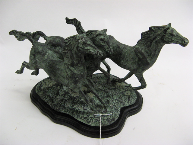 Appraisal: METAL SCULPTURE OF HORSES depicts wild horses running green patina