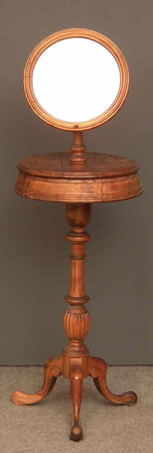 Appraisal: A Victorian walnut circular shaving stand with circular adjustable mirror