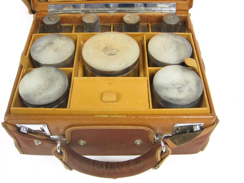 Appraisal: A George VI Asprey leather Dressing Case containing nine silver