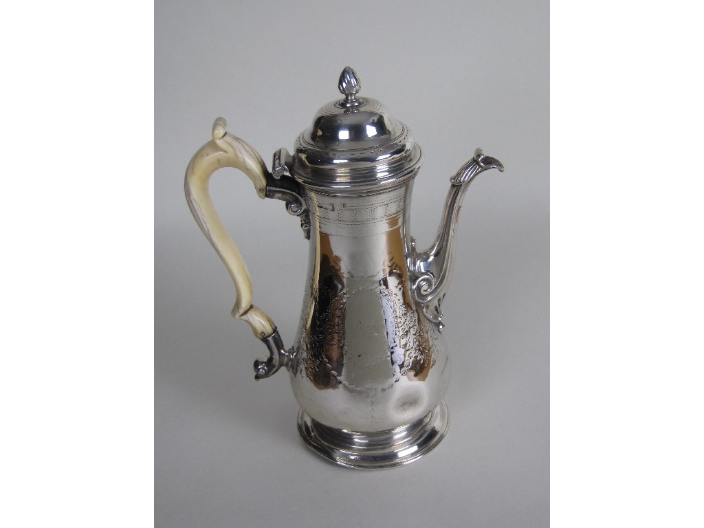 Appraisal: A George II silver baluster coffee pot the domed hinged