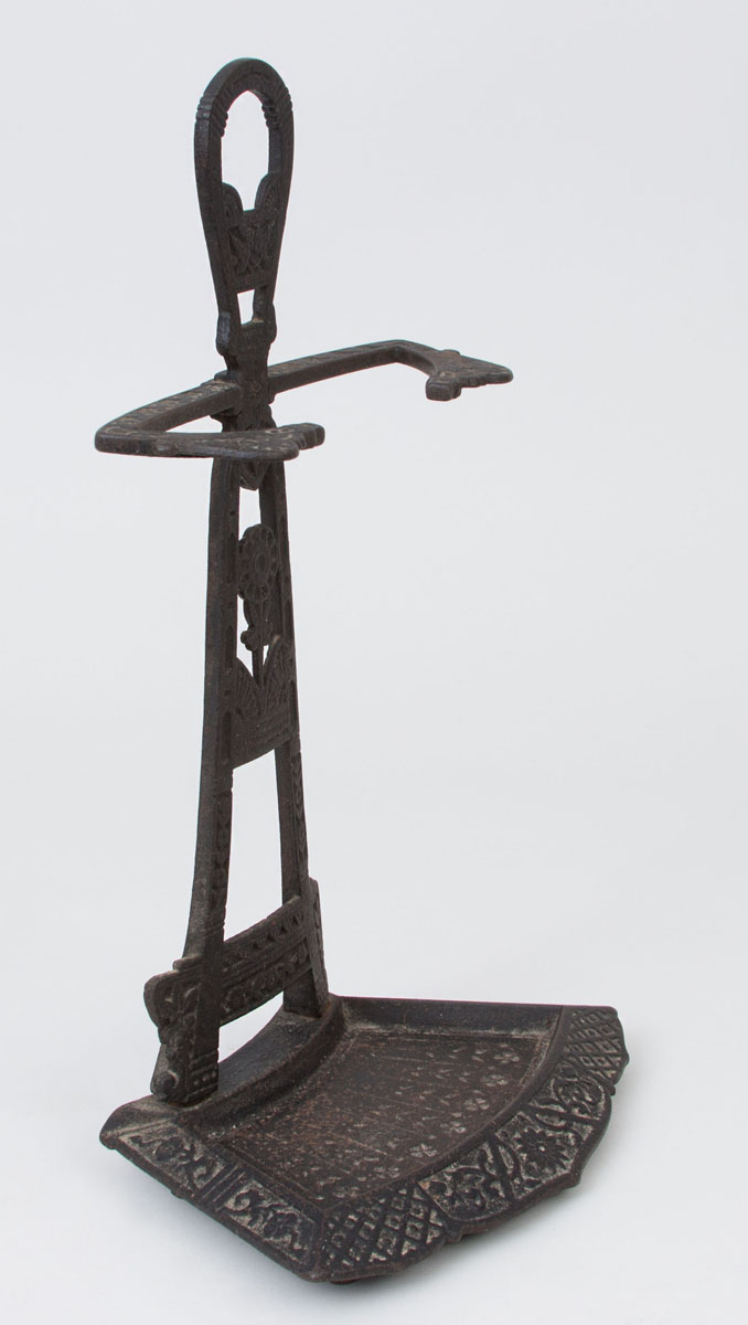 Appraisal: CAST-IRON FIRE TOOL STAND Decorated in the Aesthetic style x