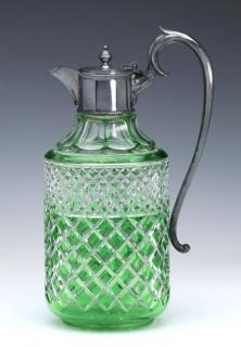 Appraisal: A green cut-to-clear crystal claret jug with silver mounts unsigned