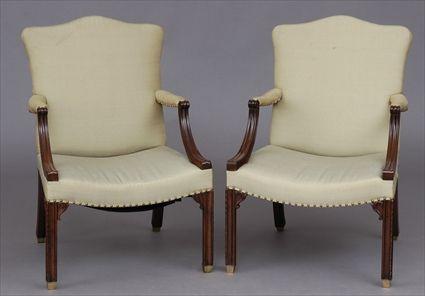 Appraisal: PAIR OF GEORGE III CARVED MAHOGANY LIBRARY ARMCHAIRS Each serpentine