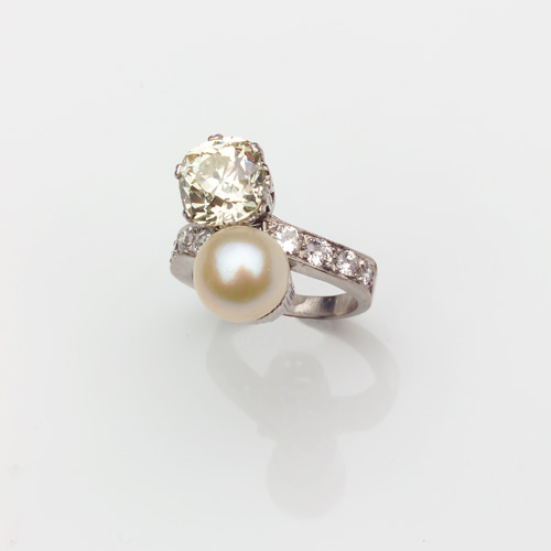 Appraisal: ART DECO Diamond and pearl bypass ring in platinum Cushion-cut