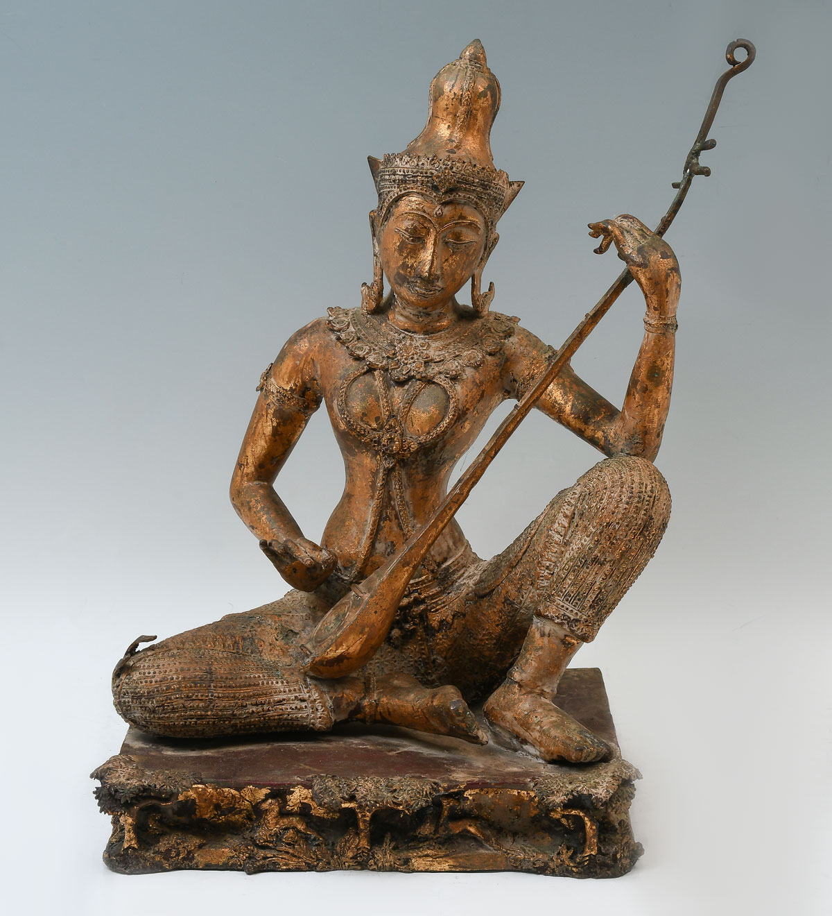 Appraisal: THAI PRINCE PRA APAI MANEE BRONZE WITH INSTRUMENT Gilt bronze