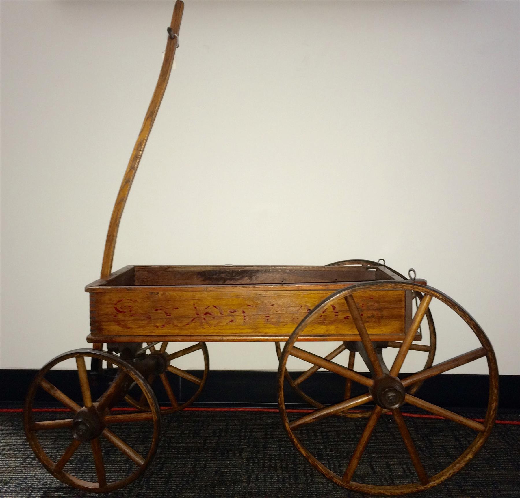 Appraisal: CHILD'S EXPRESS WAGON American ca mixed woods Finger jointed sides