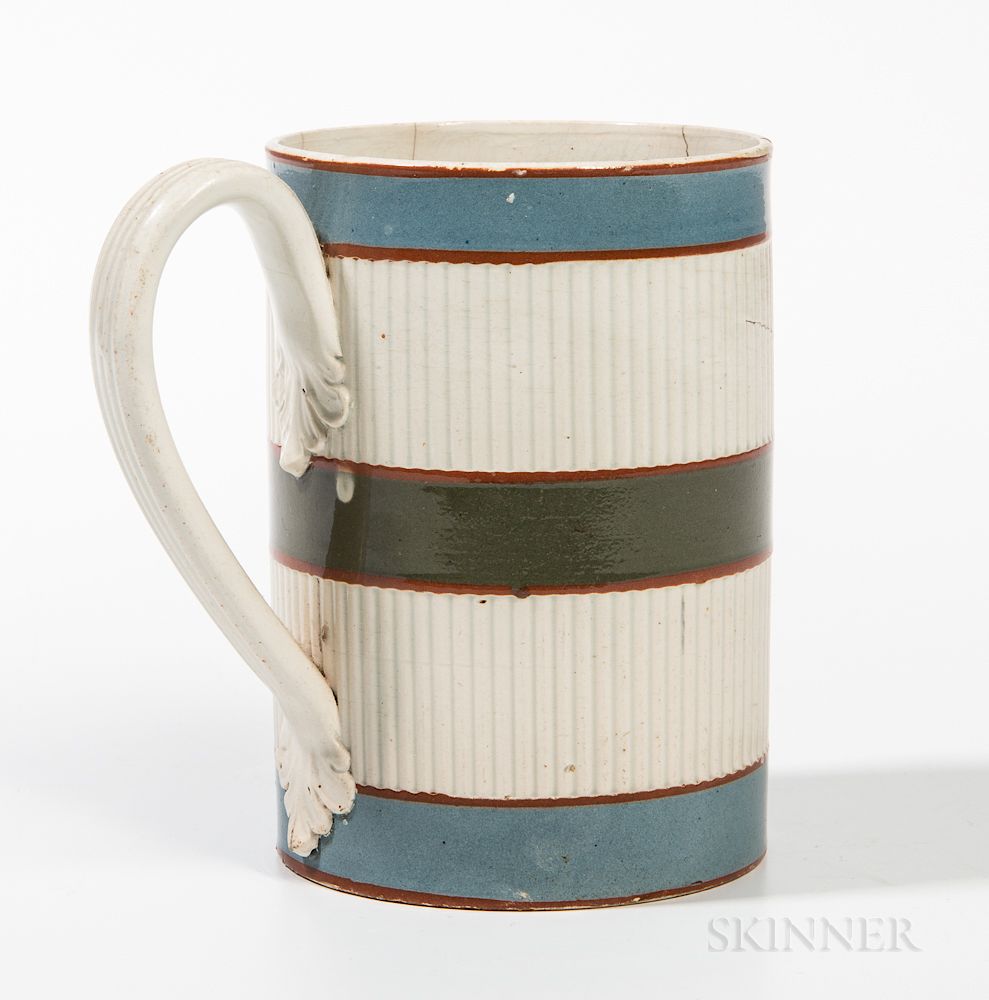 Appraisal: Mocha Pearlware and Engine-turned Pint Mug Mocha Pearlware and Engine-turned