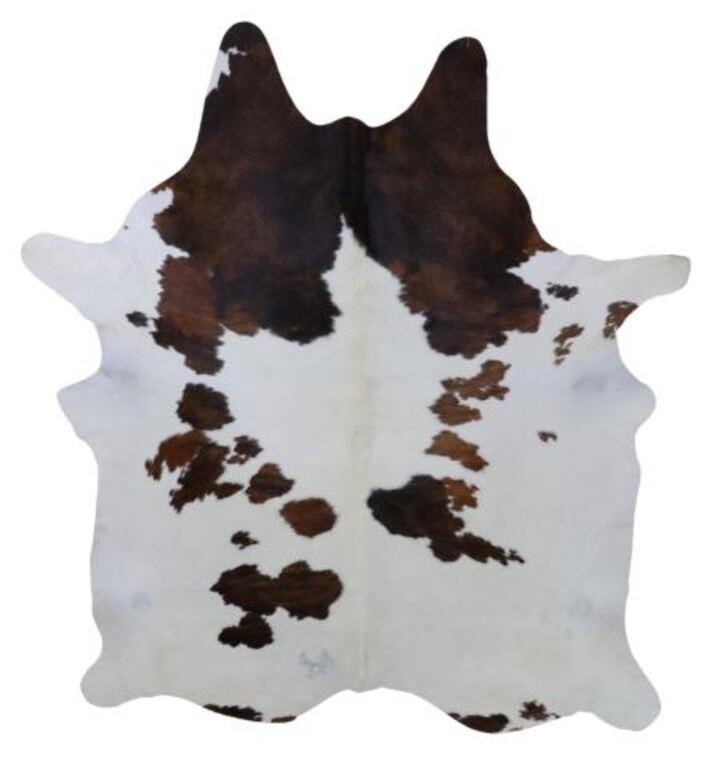 Appraisal: Cowhide white with brown spots having cattle brand approx l