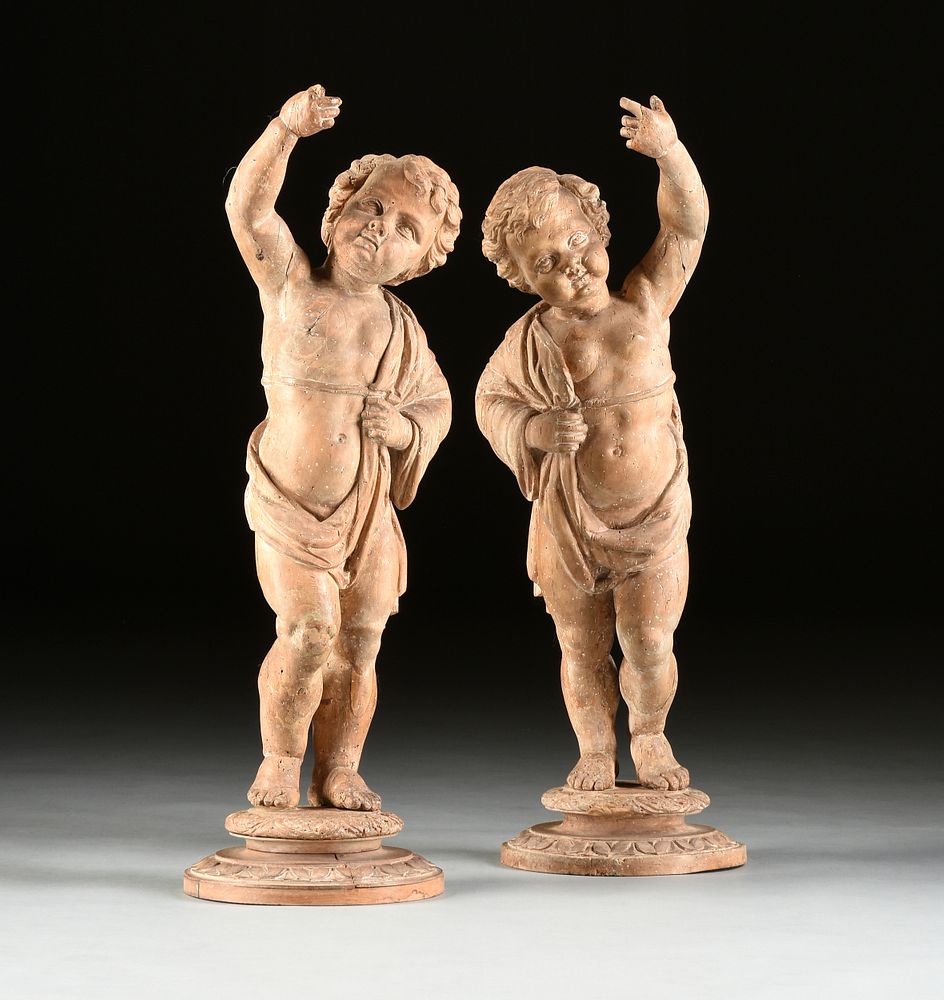 Appraisal: A PAIR OF ITALIAN BAROQUE CARVED LIMEWOOD PUTTI FIGURES TH