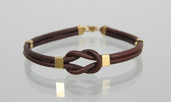 Appraisal: A Leather and k Gold Bracelet k yellow gold Cartier-style