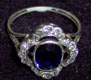 Appraisal: A sapphire and diamond cluster ring the central sapphire with