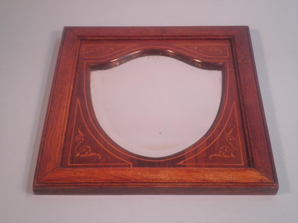 Appraisal: An Edwardian rectangular oak rosewood and marquetry wall mirror the