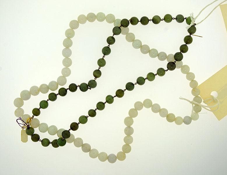 Appraisal: Jade Bead Necklaces Two jade bead necklaces one white jade