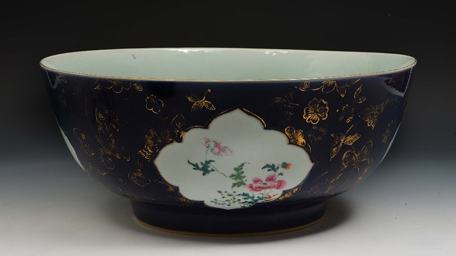 Appraisal: A Chinese large porcelain punch bowl th Centurywith reserve panels