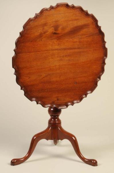 Appraisal: American Chippendale Mahogany Tea Table Description Mid th Century Pie