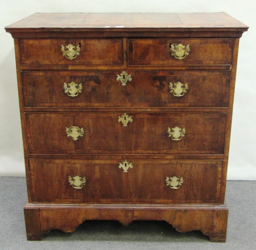 Appraisal: An early th century figured walnut chest of two short