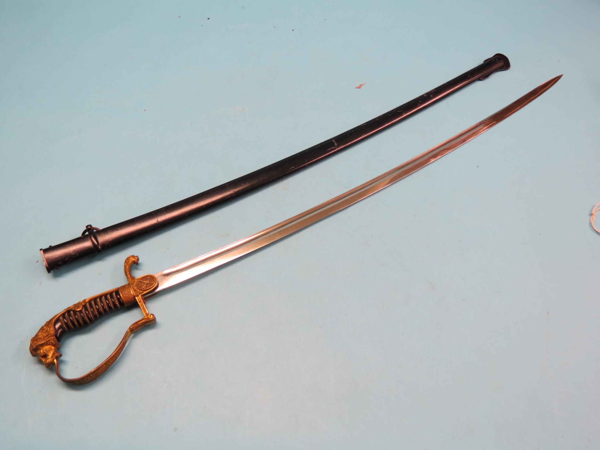 Appraisal: A German naval officer's sword in curved single-edged blade in