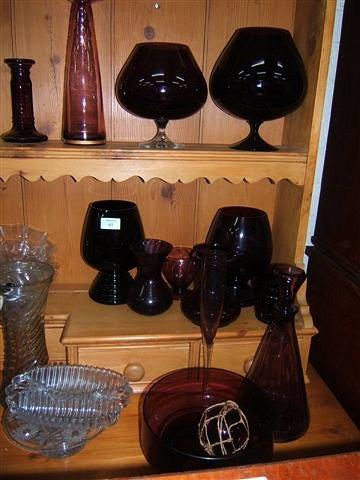 Appraisal: A small collection of purple glass including large goblets a