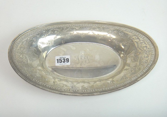 Appraisal: A silver oval dish engraved with baskets of flowers floral