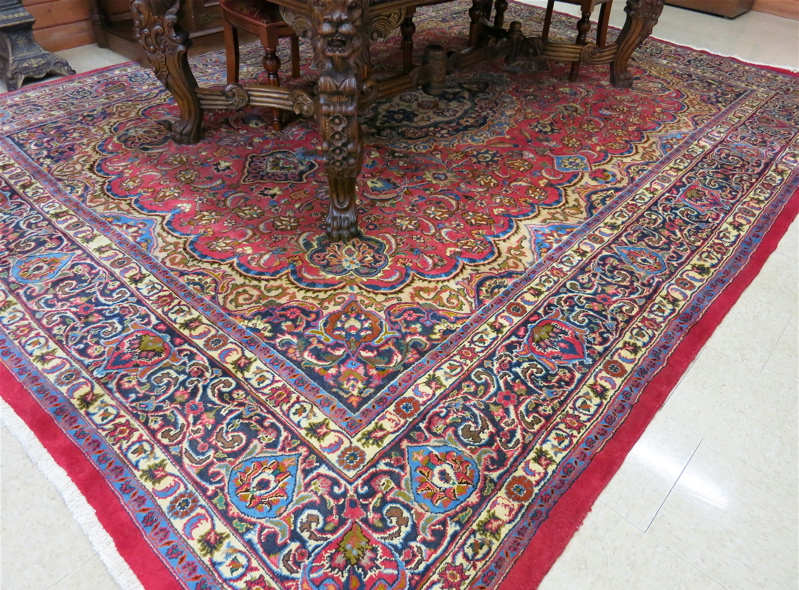 Appraisal: SEMI-ANTIQUE PERSIAN CARPET floral and central floral medallion design on