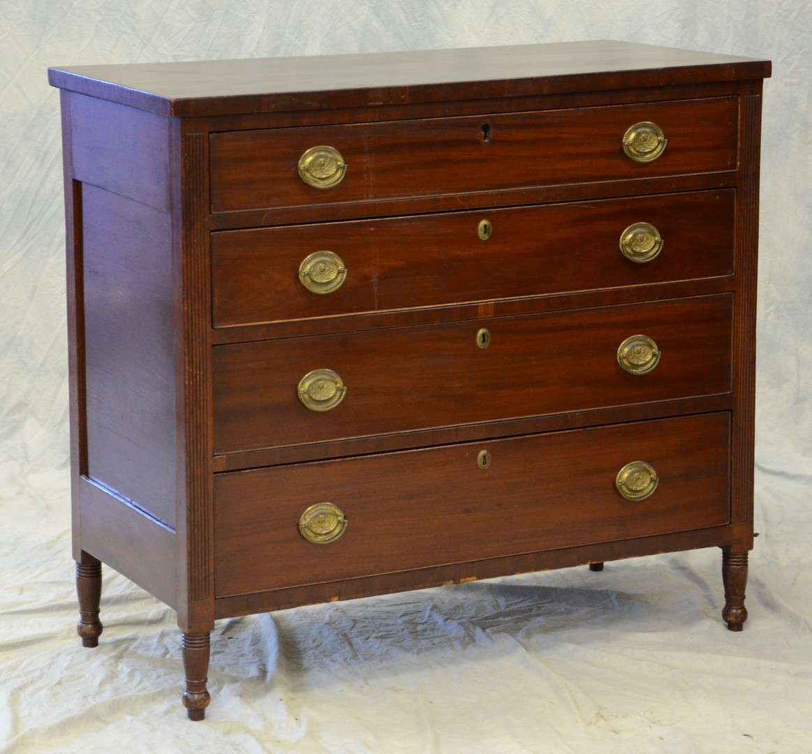 Appraisal: Mahogany Sheraton drawer chest turned legs paneled ends missing one