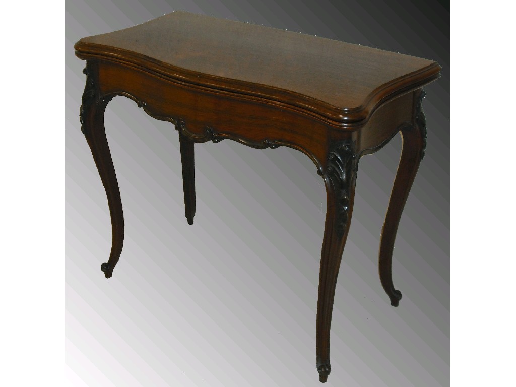 Appraisal: Victorian rosewood serpentine fold-over card table the hinged top revealing