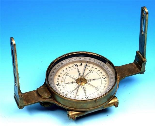 Appraisal: A TH CENTURY BRASS SURVEYING DIAL the silvered compass signed