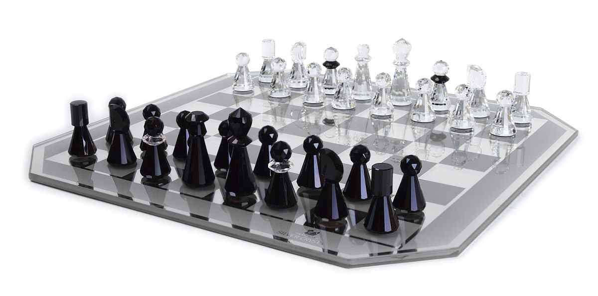 Appraisal: SWAROVSKI CRYSTAL CHESS SET Crystal pieces board designed by Max