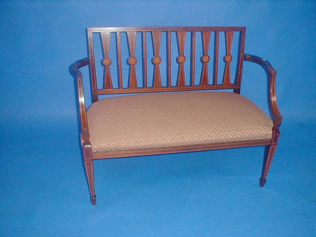 Appraisal: An Edwardian mahogany two seater boudoir settee with shell and