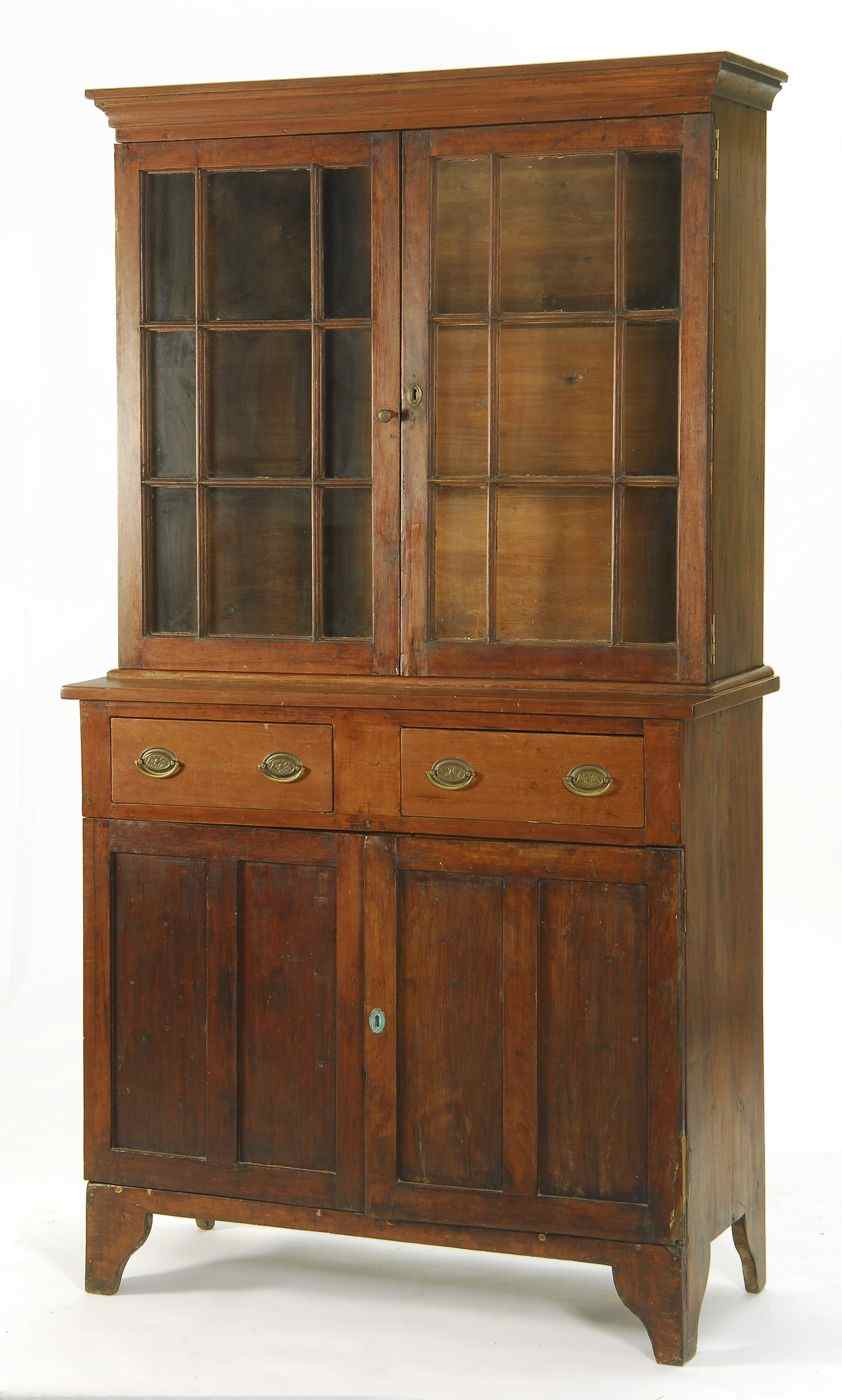 Appraisal: ANTIQUE AMERICAN TWO-PART HUTCH CUPBOARD th CenturyIn cherry with molded