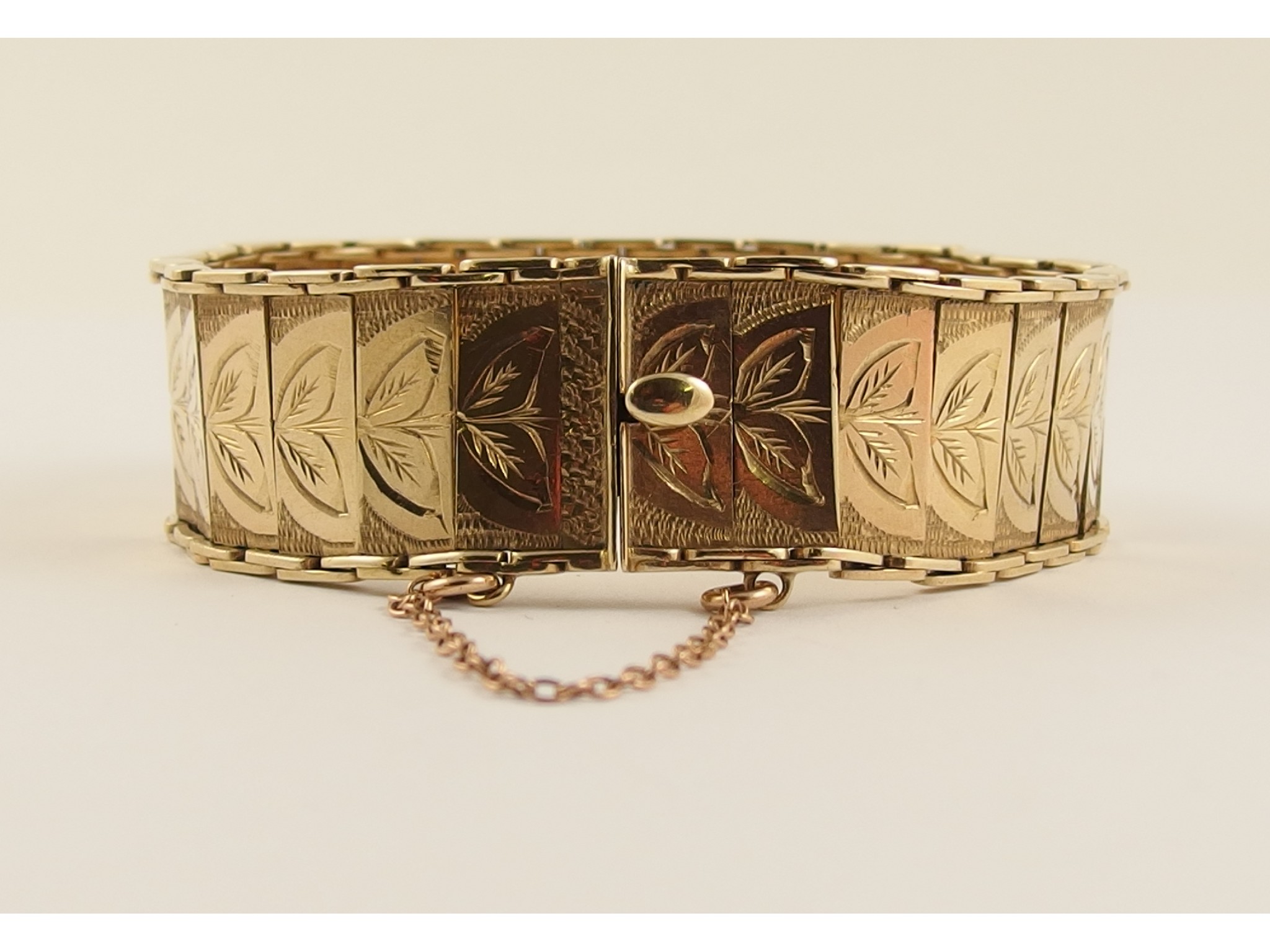 Appraisal: A ct leaf engraved braceletcirca the engraved panels are hinged