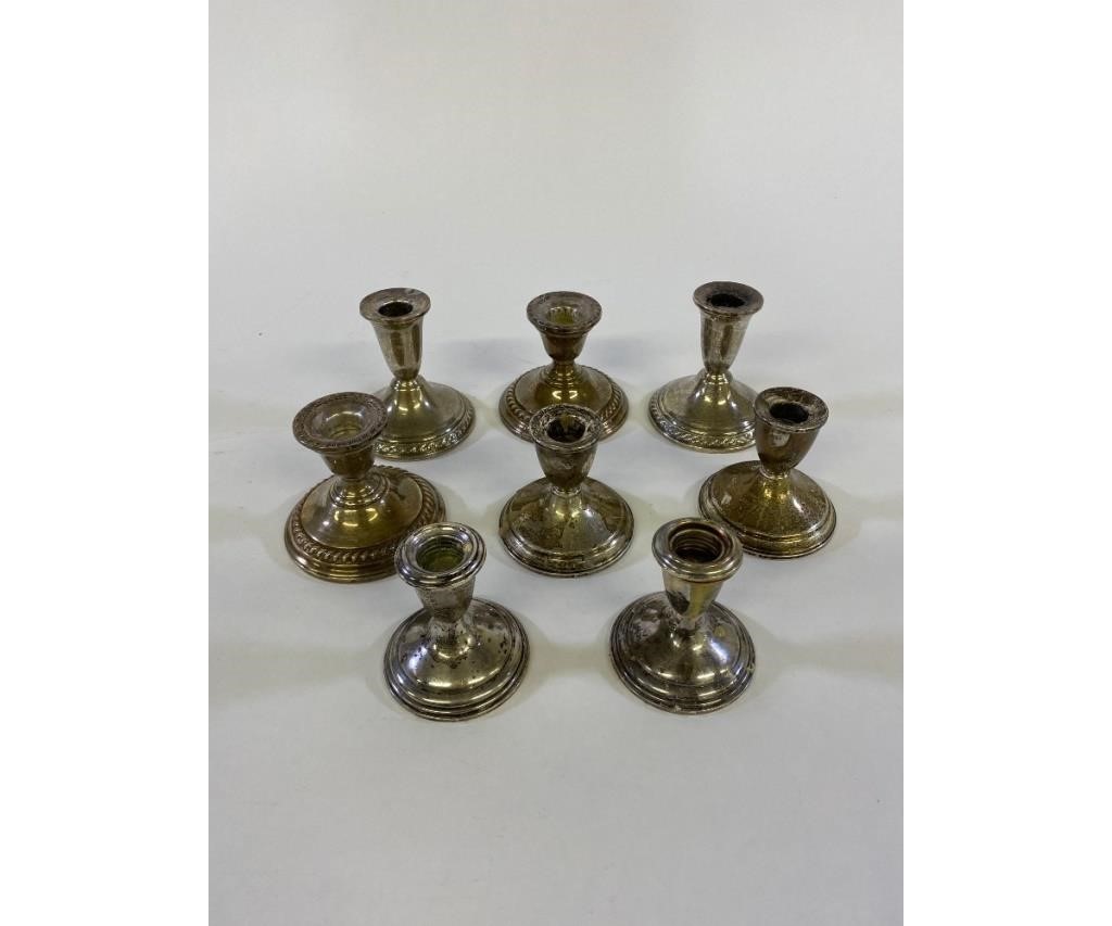 Appraisal: Four pair of weighted sterling silver candlesticks tallest h Condition