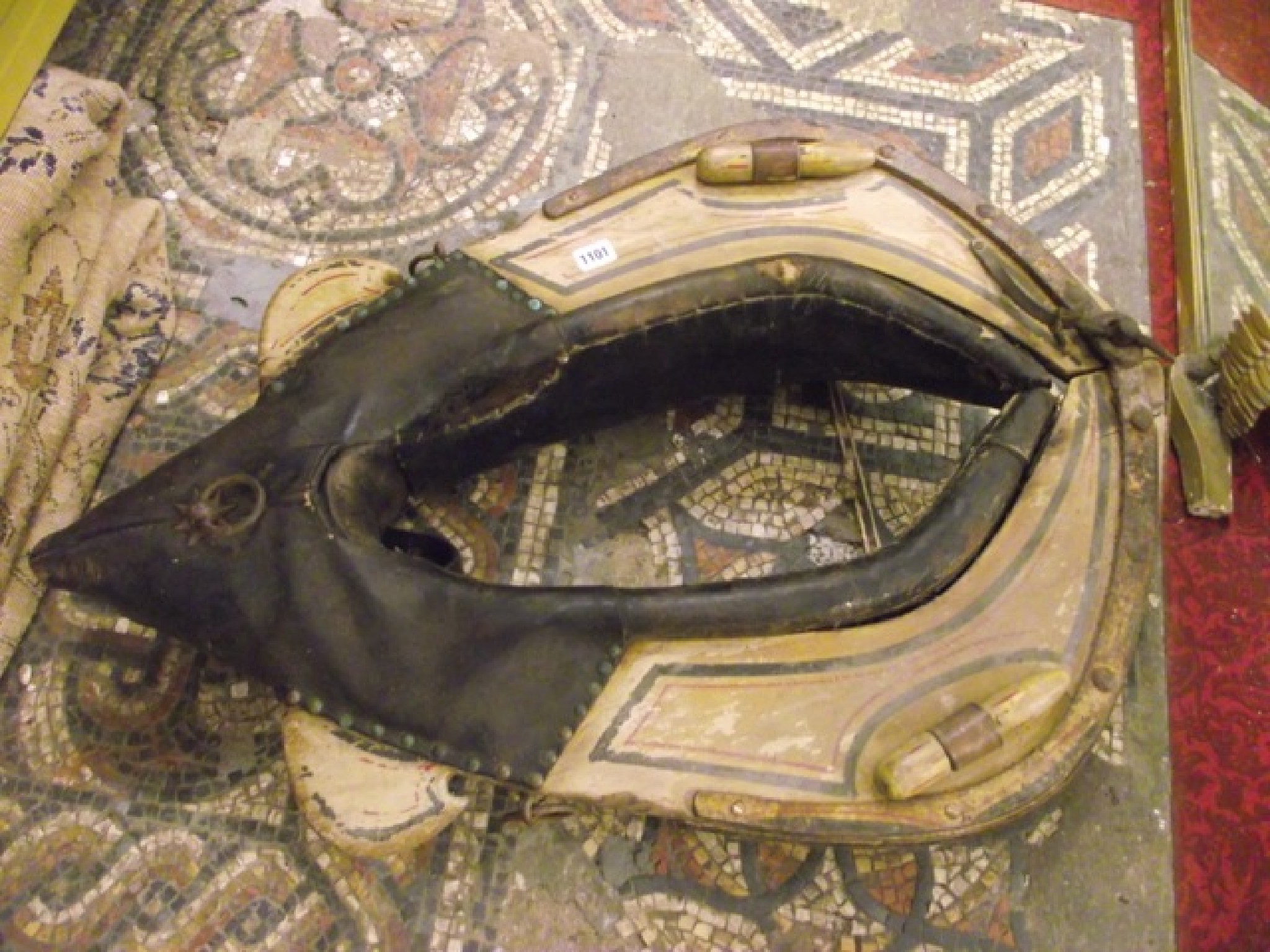 Appraisal: An antique timber framed horse collar with applied iron banding