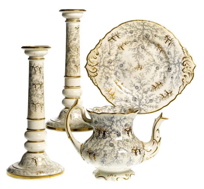 Appraisal: A RARE PAIR OF ROCKINGHAM CANDLESTICKS the double knopped pillar