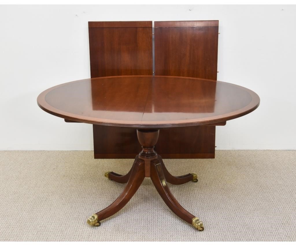 Appraisal: Stickley Hepplewhite style mahogany inlaid dining table with brass paw