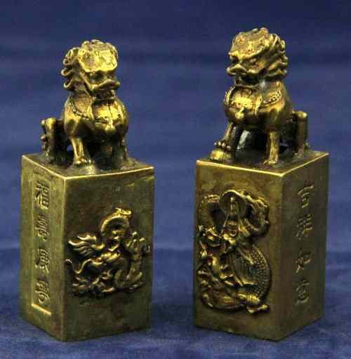 Appraisal: Two Chinese brass seals each with Dog of Fo handles