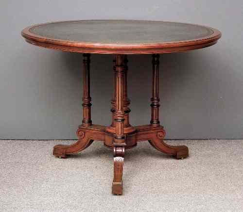 Appraisal: A late Victorian walnut circular centre or library table by