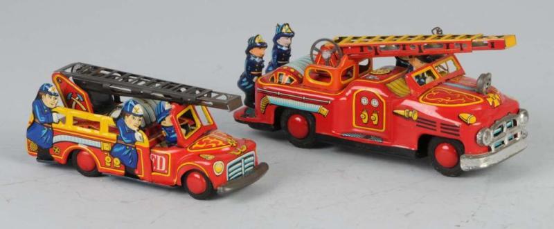 Appraisal: Lot of Tin Fire Engine Friction Toys Description Japanese Working