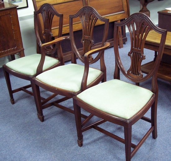 Appraisal: A set of mahogany dining chairs of Sheraton design the