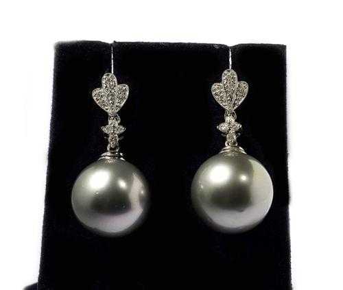 Appraisal: TAHITI PEARL AND BRILLIANT-CUT DIAMOND STUD EARRINGS White gold Elegant