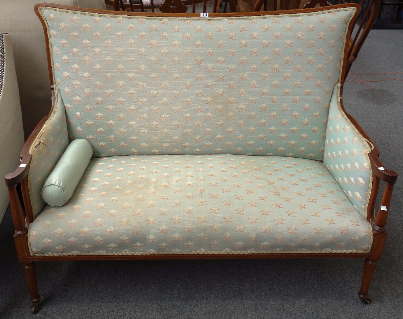 Appraisal: An Edwardian chequer strung mahogany sofa with concave crest rail