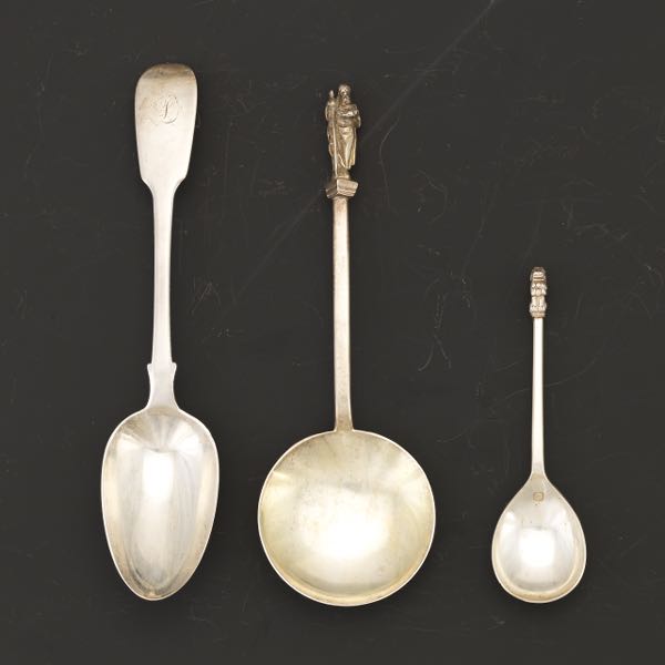 Appraisal: THREE ENGLISH STERLING SILVER SERVING SPOONS LONDON AND SHEFFIELD Including