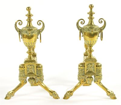 Appraisal: A pair of late Victorian brass andirons the vase finials