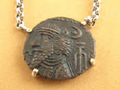 Appraisal: A Byzantine coin mounted as a necklace in white metal