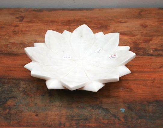 Appraisal: A hand carved white marble bowl carved as a lotus